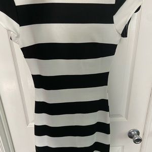 Mid length, tight scoop back dress